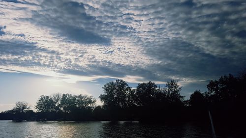 Scenic view of lake against sky at sunset