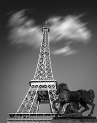 Low angle view of statue against eiffel tower