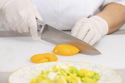 Midsection of person preparing food on table