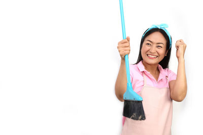 Portrait of a smiling young woman over white background