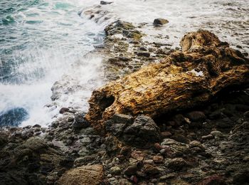 High angle view of rock formation in sea