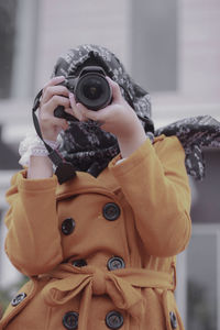 Woman photographing with camera