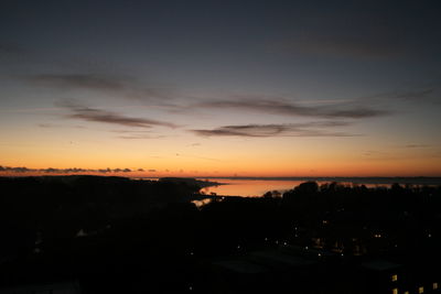 Scenic view of silhouette landscape against sky at sunset