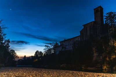 Low angle view of building against sky at dusk