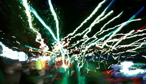 Low angle view of trees against sky at night