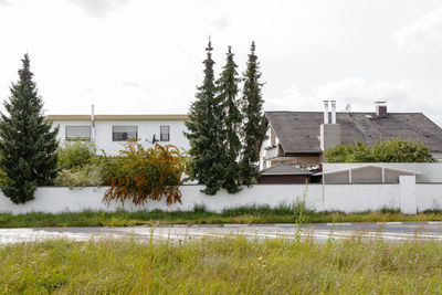 Built structure with trees in foreground