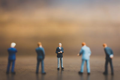 Figurines on wooden table