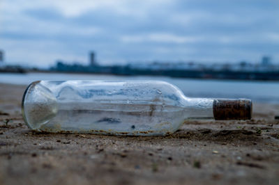 Close-up of water bottle in snow