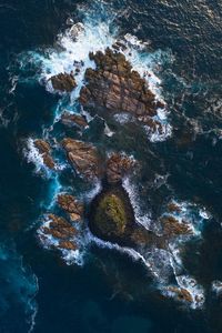 High angle view of rock formation in sea