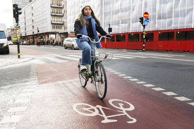 Smiling woman cycling