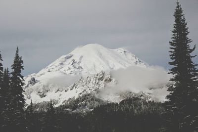 Scenic view of snow covered mountains against sky