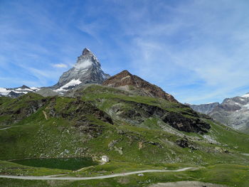 Low angle view of majestic mountains against sky