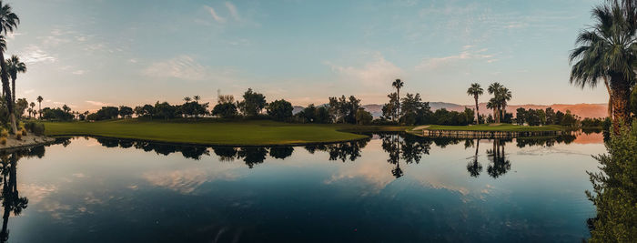 Scenic view of lake against sky during sunset