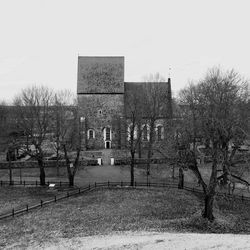 Built structure with trees in foreground