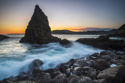 Scenic view of sea against sky during sunset