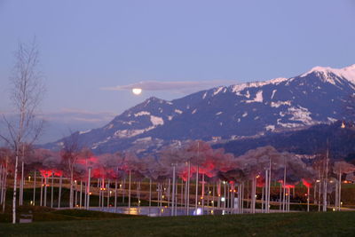 Scenic view of snowcapped mountains against sky at dusk