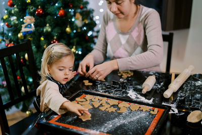 Portrait of boy playing with christmas tree