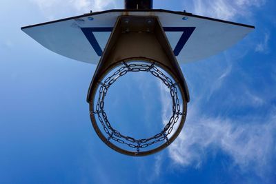 Basketball hoop and blue sky on the street