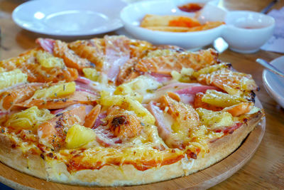 Close-up of pizza served on table