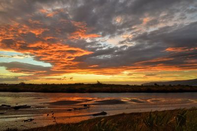 View of dramatic sky over landscape during sunset