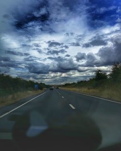 Road seen through car windshield