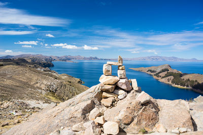 Stacked stones against sea