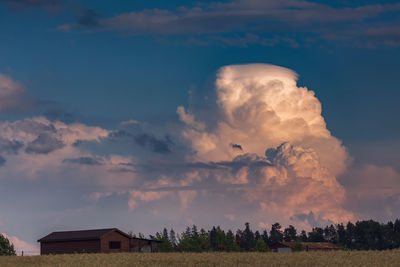 Panoramic shot of buildings against sky during sunset