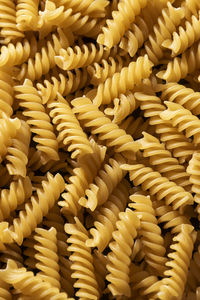 Close up of raw pasta, healthy food ingredients backdrop