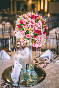 Close-up of flower vase on table in restaurant
