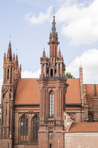 Low angle view of cathedral against cloudy sky