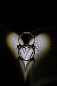 Close-up of wedding rings on table