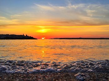 Scenic view of sea against sky during sunset