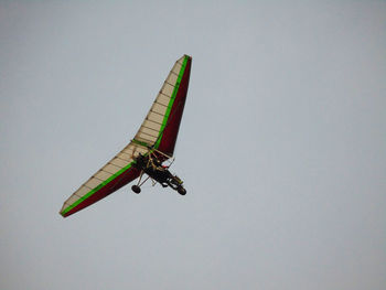 Low angle view of kite flying against clear sky