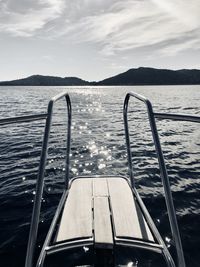 Boat sailing on sea against sky