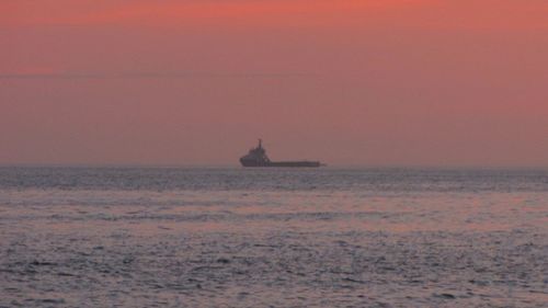 Scenic view of sea at sunset