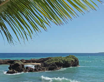 Scenic view of sea against clear blue sky