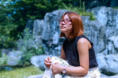 Portrait of young woman using mobile phone