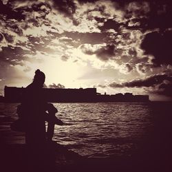 Silhouette of people at sunset