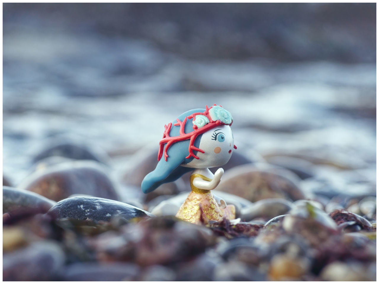 sea, nature, transfer print, no people, water, auto post production filter, land, day, outdoors, cartoon, animal, beach, representation, toy, animal themes, focus on foreground, selective focus, close-up, rock