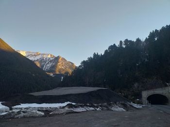 Scenic view of snowcapped mountains against clear sky