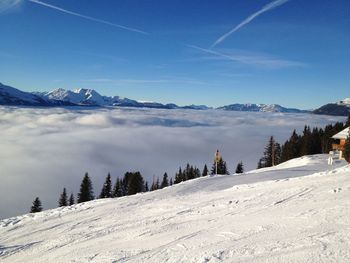 Scenic view of snow covered mountains against sky