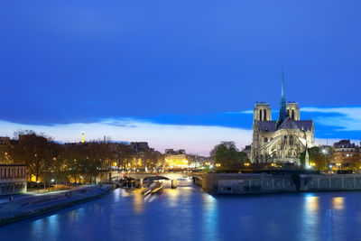 Notre dame cathedral on ile de la cite and pont de l'archeveche over the seine river, paris, france