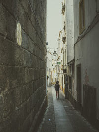 Man walking in alley