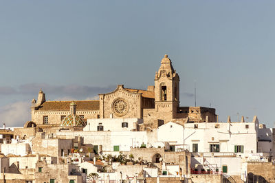 View of buildings in town against sky