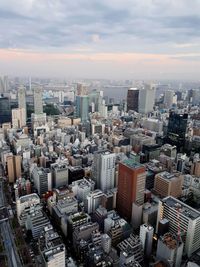 High angle view of modern buildings in city against sky