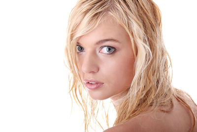 Close-up portrait of a beautiful young woman over white background