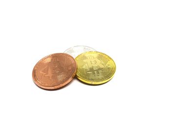 Close-up of coins on white background