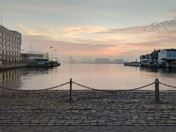 Scenic view of river against sky during sunset