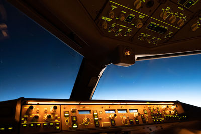 Interior of illuminated airplane cockpit
