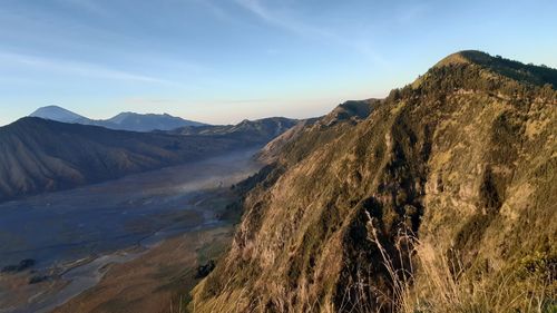 Panoramic view of rocky mountains against sky